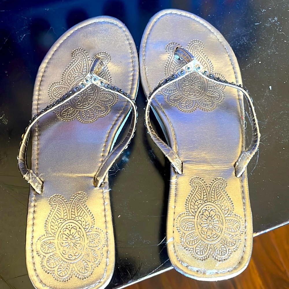 These are classic silver short short plat form flip flops